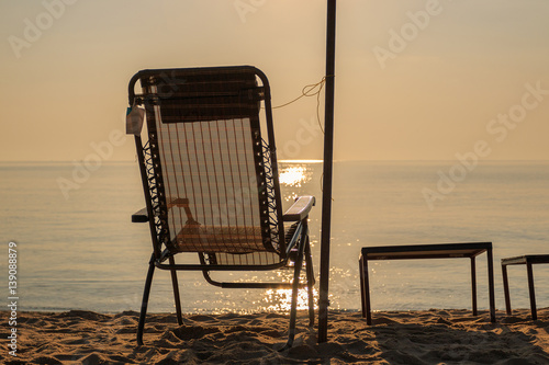 Beach chair and beach umbrella  Sunrise and sea landscape  nature background.