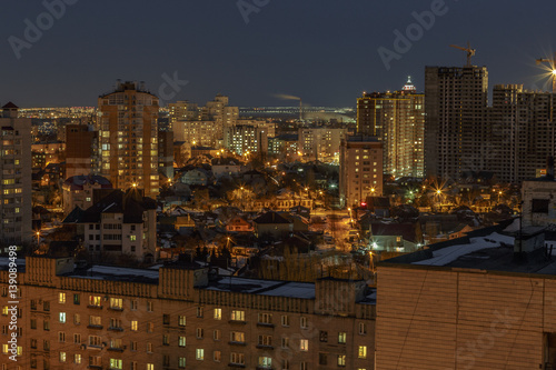 Night aerial winter cityscape view of living area in Voronezh, houses © DedMityay