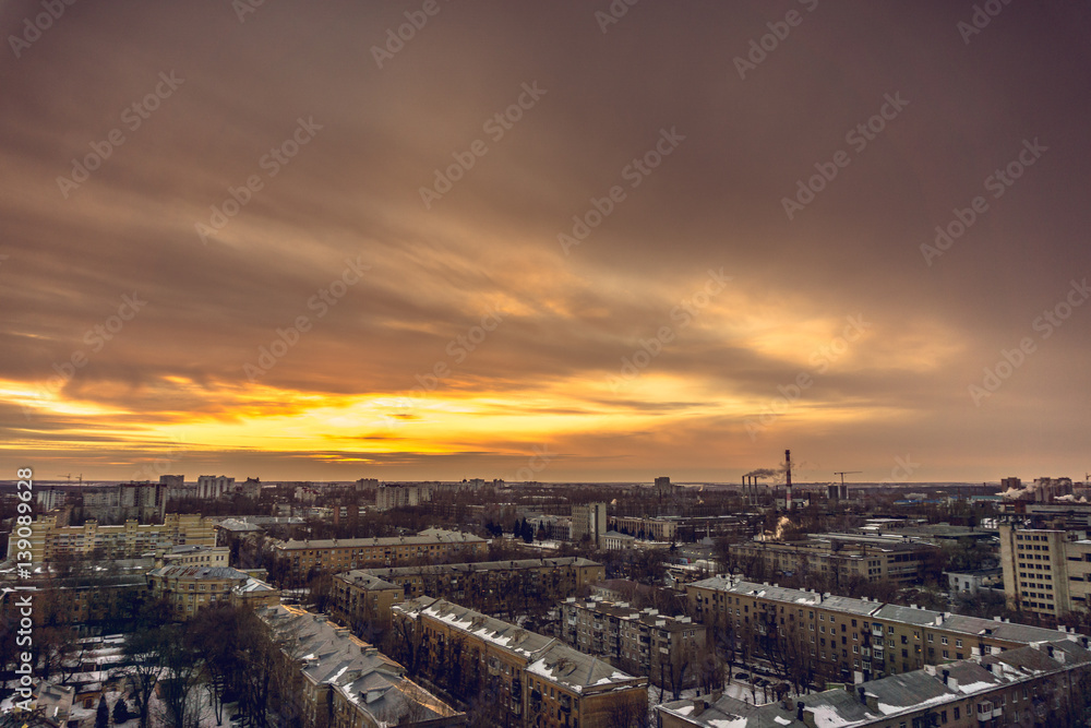 Aerial evening cityscape from rooftop of Voronezh. Houses, sunset, sky, clouds