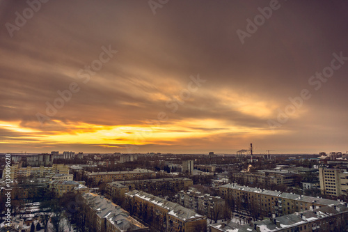 Aerial evening cityscape from rooftop of Voronezh. Houses, sunset, sky, clouds