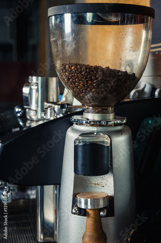 Fotografie, Tablou Coffee grinder preparing to grind coffee