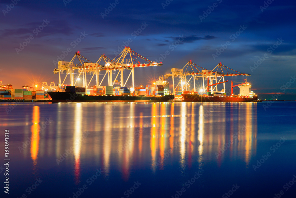 Containers loading by crane in the evening trade port shipping, Shipping and logistic concept