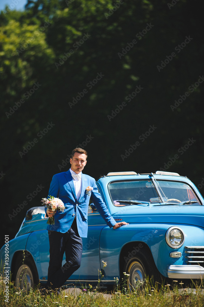 Groom with Bouquet at Cabriolet Groom with Bouquet at Cabriolet