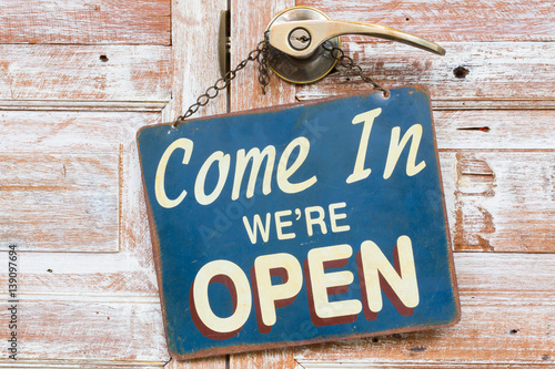 Obraz na plátne sign Come In We're Open on the wooden door, retro vintage style
