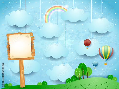 Surreal landscape with hot air balloons and wooden sign