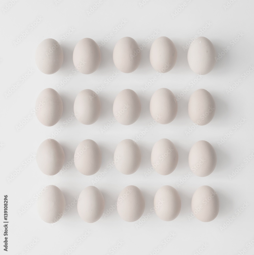 Creative layout made of eggs on white background. Flat lay. Easter concept. Creative layout made of eggs on white background. Flat lay. Easter concept.