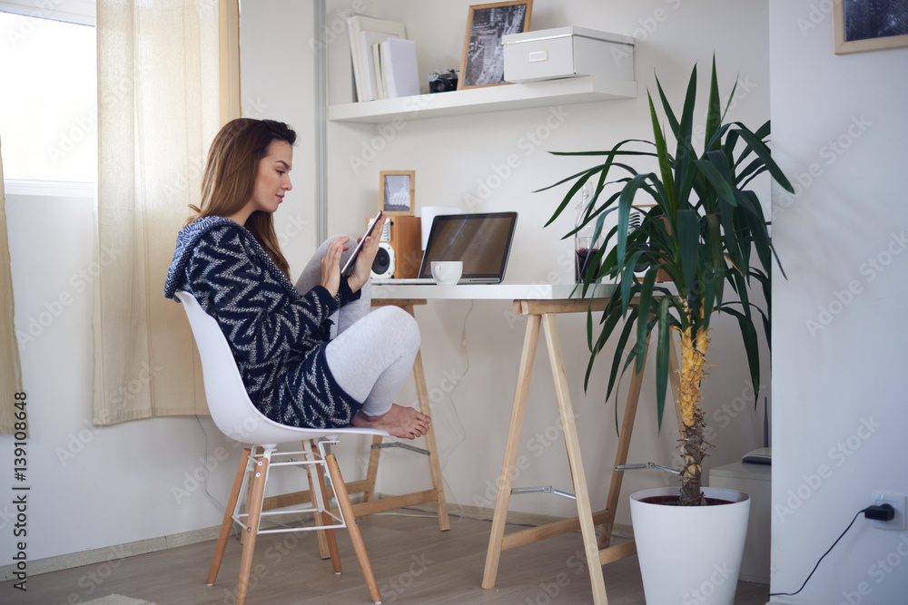 Young business girl in her personal workspace and working Young business girl in her personal workspace and working