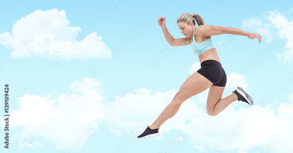 Athlete jumping against sky in background Athlete jumping against sky in background