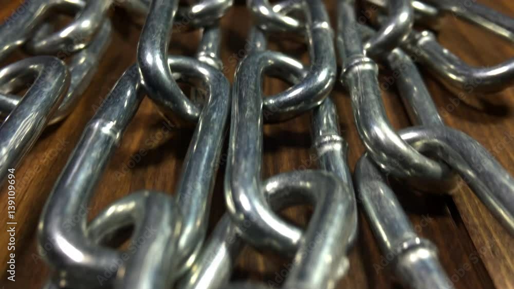 Security. Track forward over the links of a steel chain. Security. Track forward over the links of a steel chain.