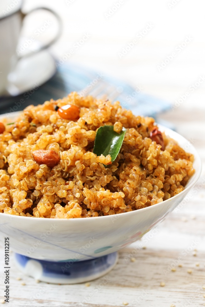 Quinoa Puliyogare or Puliyodharai served in a bowl, selective focus Quinoa Puliyogare or Puliyodharai served in a bowl, selective focus
