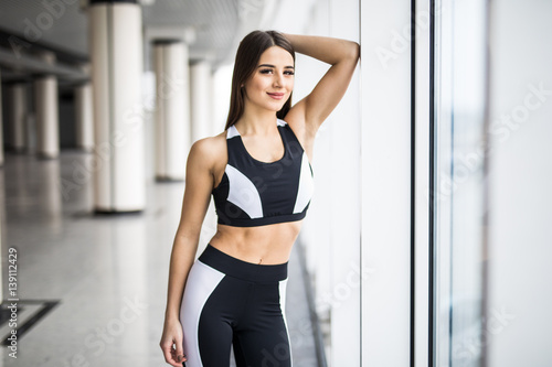 beautiful girl standing in the gym at the window © F8  \ Suport Ukraine