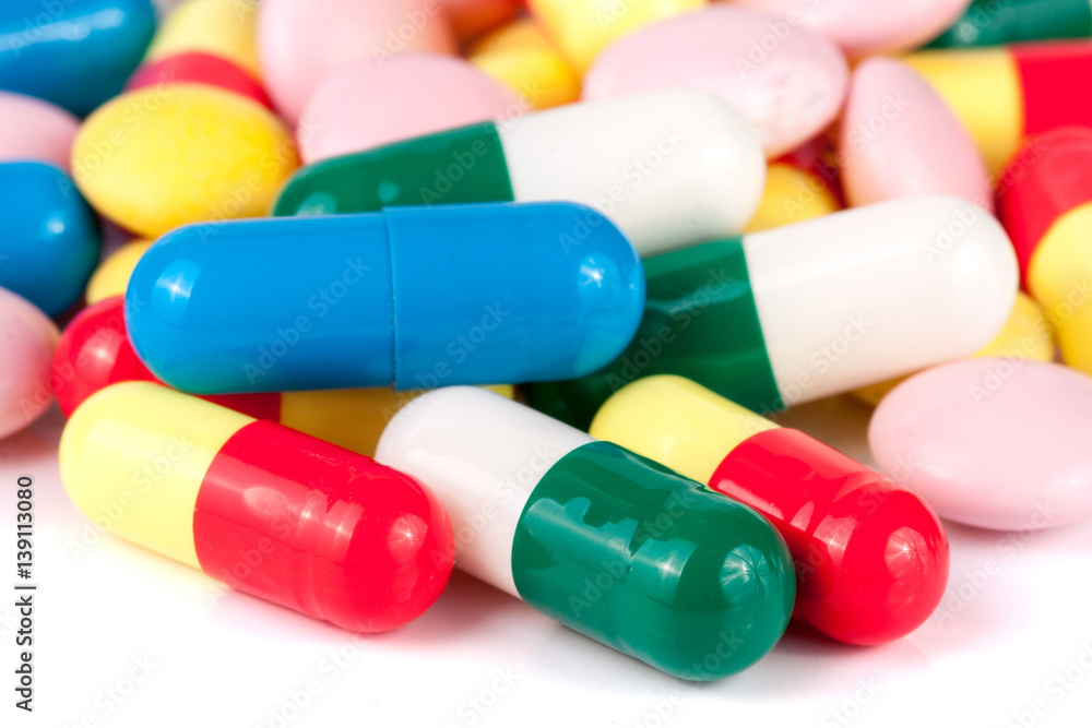 colorful pills isolated on white background colorful pills isolated on white background