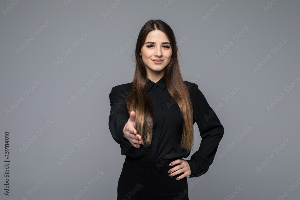 Portrait of young cheerful beautiful business woman giving hand for handshake Portrait of young cheerful beautiful business woman giving hand for handshake