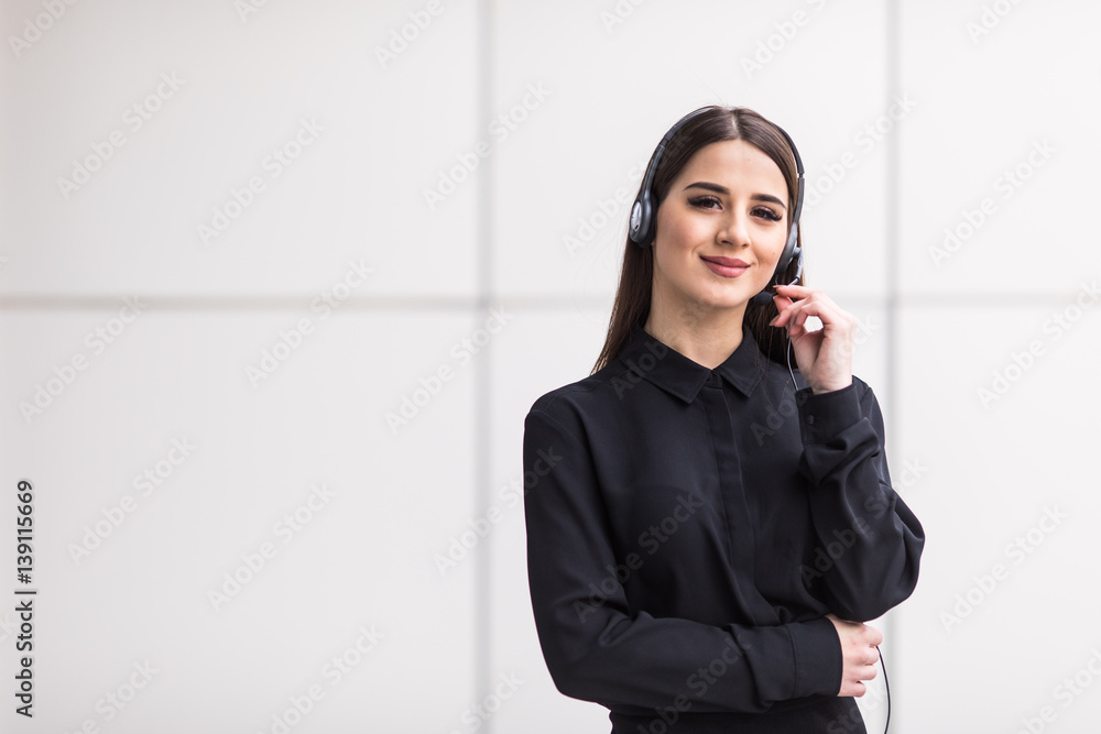 Portrait of smiling cheerful customer support phone operator in headset Portrait of smiling cheerful customer support phone operator in headset