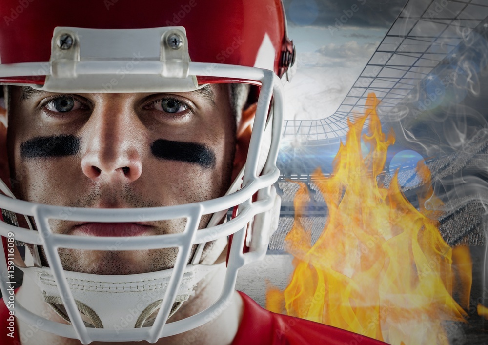 American football player with flames and stadium in background American football player with flames and stadium in background