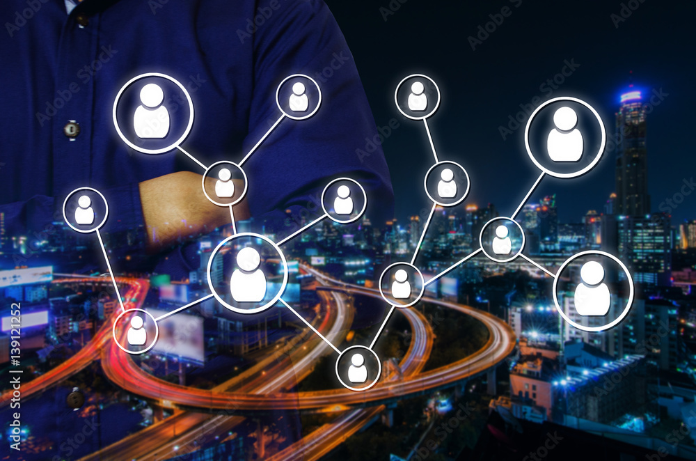 double exposure of man crossing arms and social media network connection concept on night city background, color tone effect.
