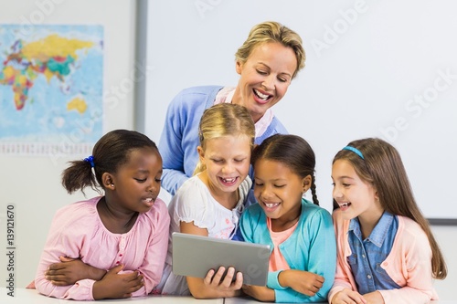 Teacher and kids using digital table