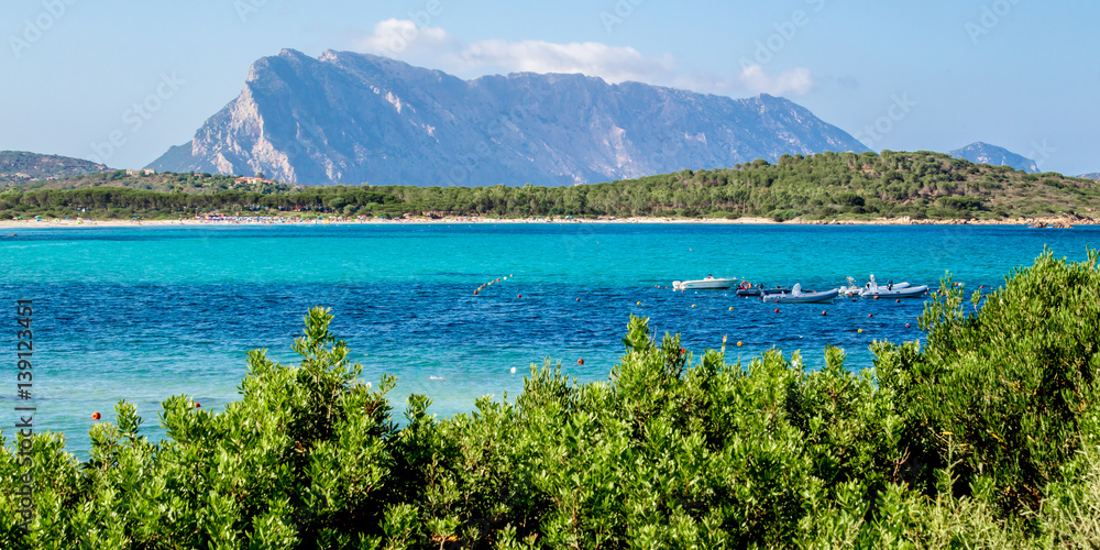 Fototapeta premium Lu impustu beach in Sardinia, with Tavolara island in the background, Italy