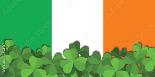 St. Patrick's day vector horizontal background with shamrock leaves. The Shamrock on the background of the flag of Ireland.