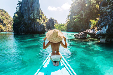 Woman travelling on the boat in Asia