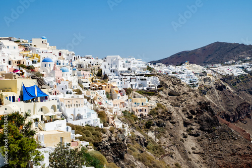 view with traditional white buildings over the village of Oia © izhphoto
