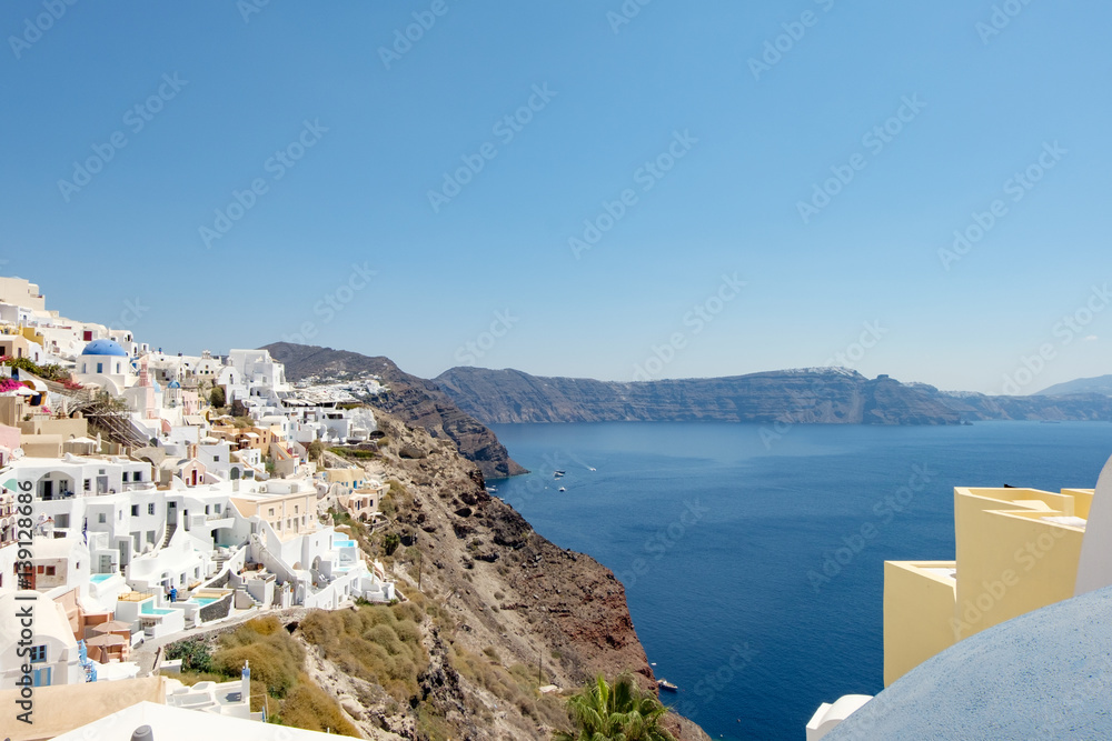 view with traditional white buildings over the village of Oia
