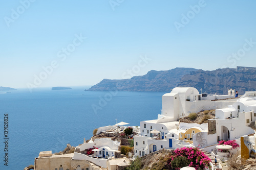 view with traditional white buildings over the village of Oia