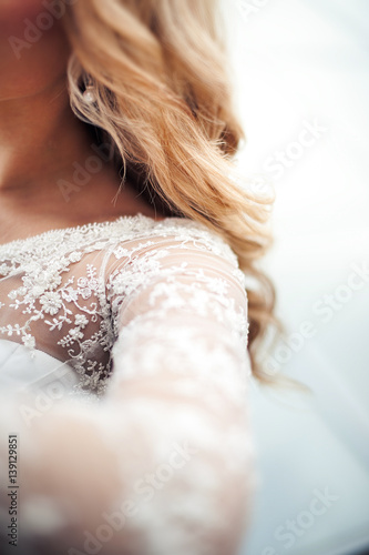 close up of bridal wedding white dress . cloth and beads