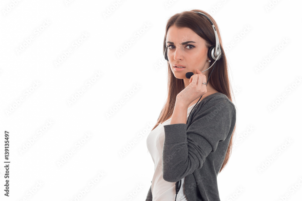 serious young girl in headphones looks away and bitten lip serious young girl in headphones looks away and bitten lip