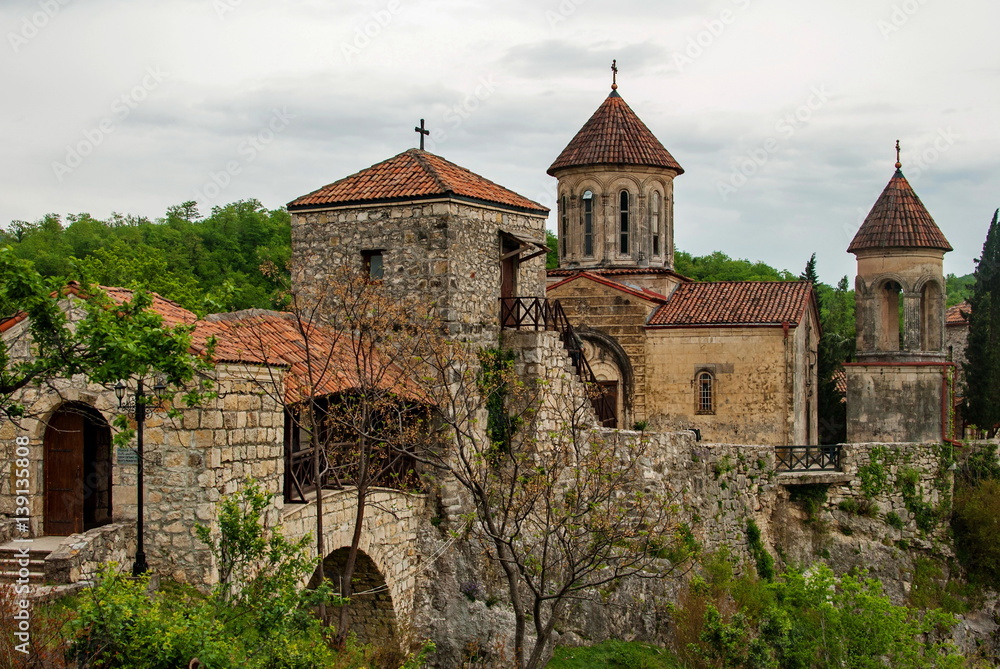 Motsameta Monastery - a small temple in the surrounding area of Kutaisi. It buried Martyrs David and Constantine. It located in a picturesque location on a cliff at the winding river. Motsameta Monastery - a small temple in the surrounding area of Kutaisi. It buried Martyrs David and Constantine. It located in a picturesque location on a cliff at the winding river.
