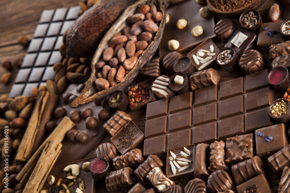 Dark and milk chocolate bar on a wooden table Dark and milk chocolate bar on a wooden table