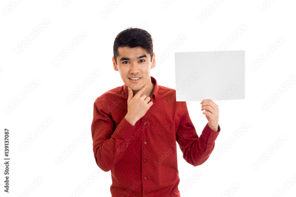 handsome young brunette man posing with empty placard in his hands and smiling on camera isolated on white background handsome young brunette man posing with empty placard in his hands and smiling on camera isolated on white background