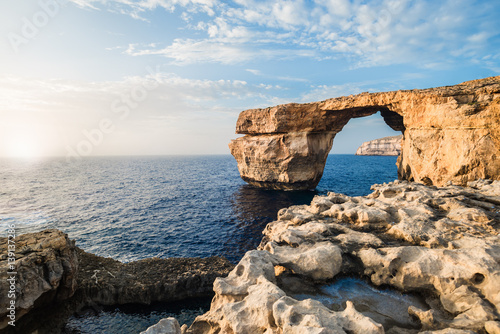 Fototapeta Naklejka Na Ścianę i Meble -  Famous stone arch formation. Landscape view in Malta, Europe during sunset. Azure Window.