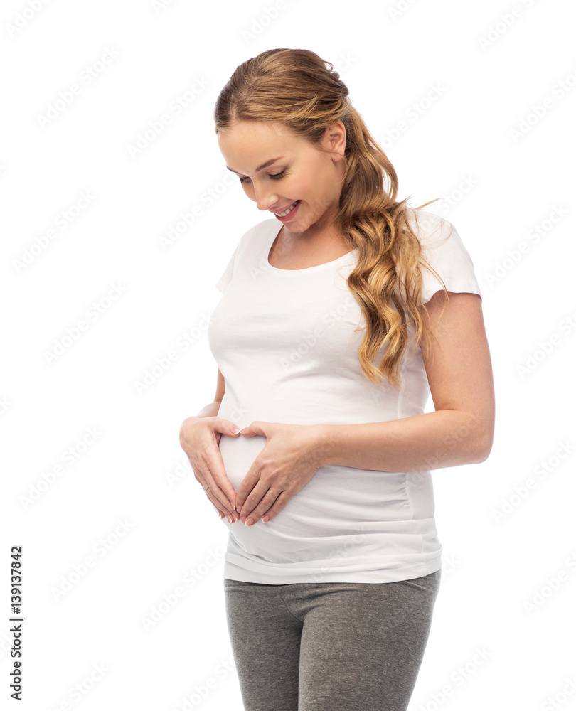 happy pregnant woman showing heart gesture happy pregnant woman showing heart gesture