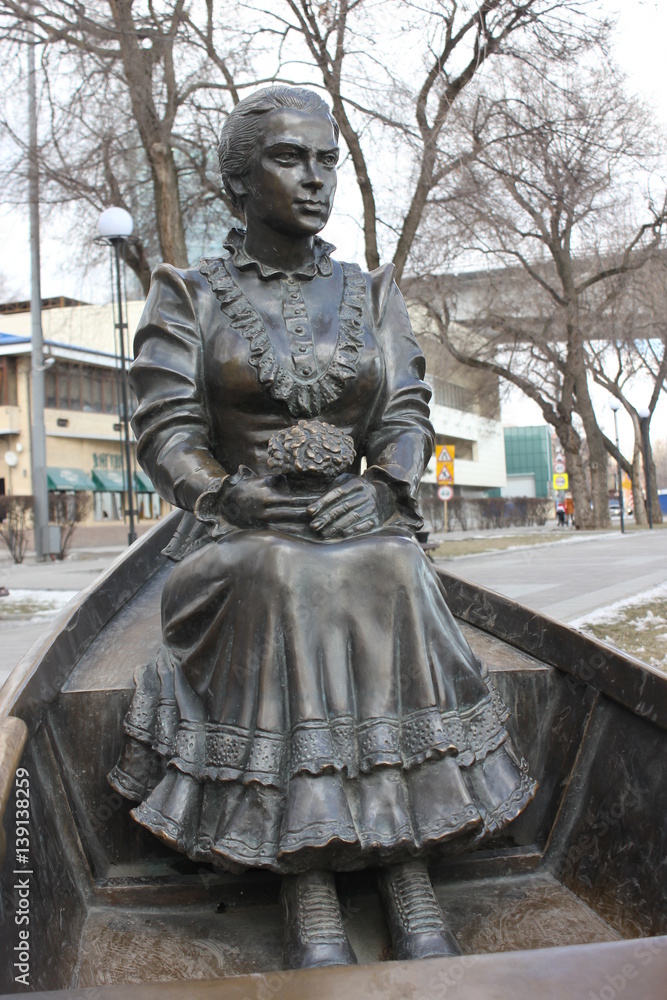 the bronze monument on the banks of the river