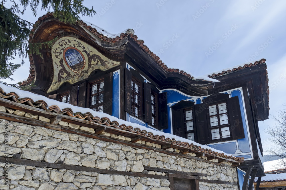 Antique cobblestone street with beauty ancient houses, town Koprivshtitsa, Bulgaria 