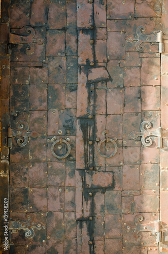 Old rusty iron door forged