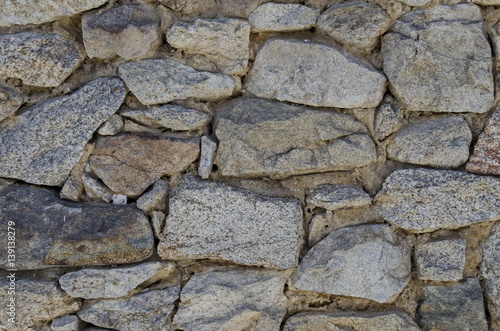 Ancient stone wall texture background with wooden consolidation,  Koprivshtitsa, Bulgaria 