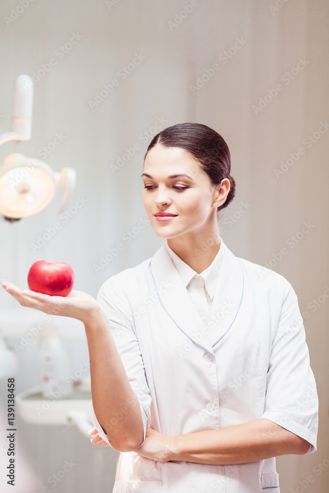 Young woman posing doctor in a dentist's office Young woman posing doctor in a dentist's office