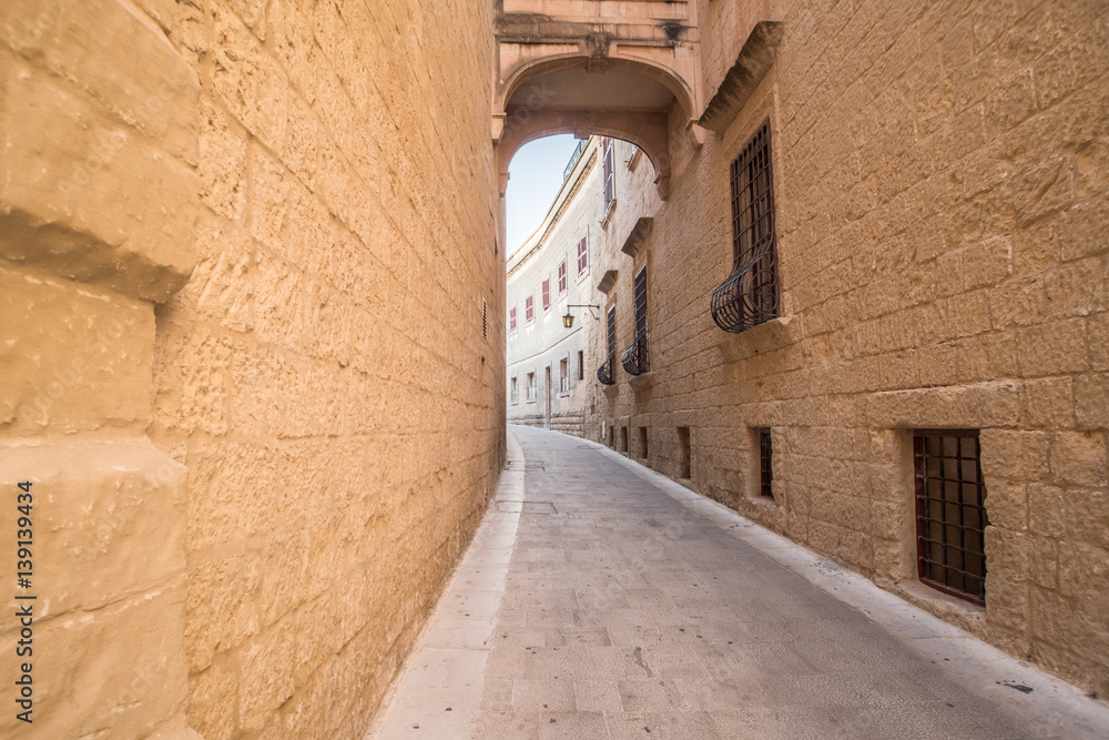 Old street in Rabat, Malta, atmospheric, winding alley.