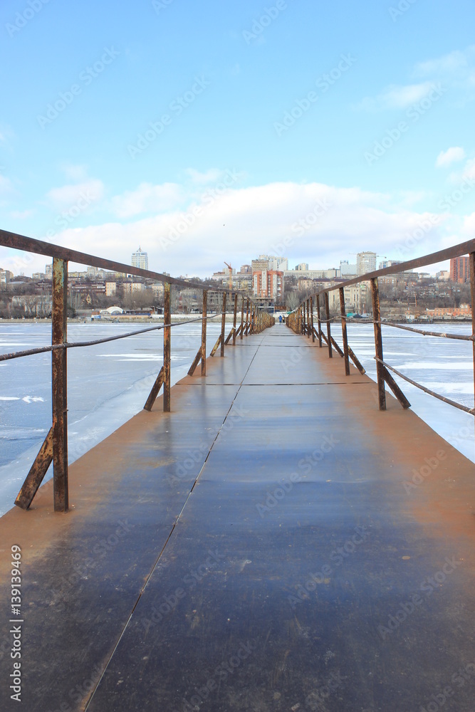 the metal bridge over the river