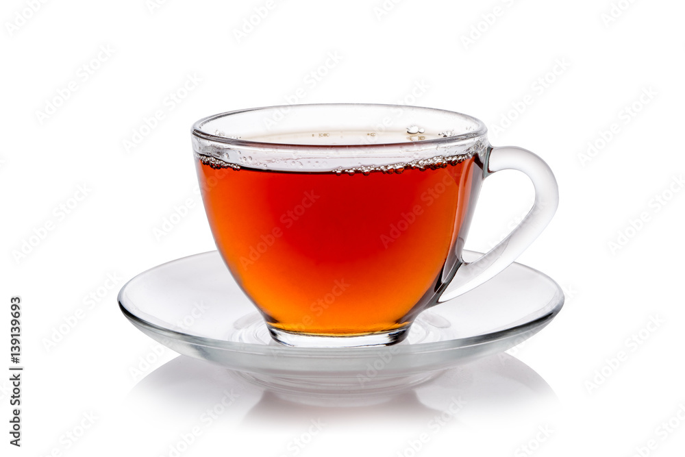 Transparent glass cup of tea and a saucer isolated on white background Transparent glass cup of tea and a saucer isolated on white background