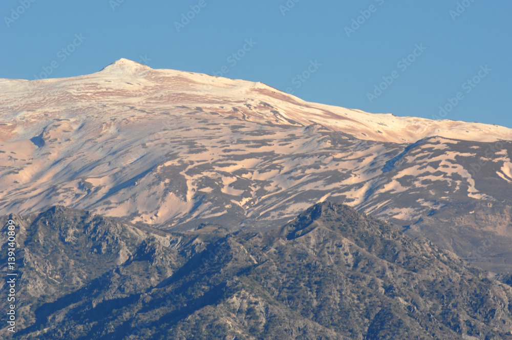 Naklejka premium snowy summits colored by the dust of the Sahara desert