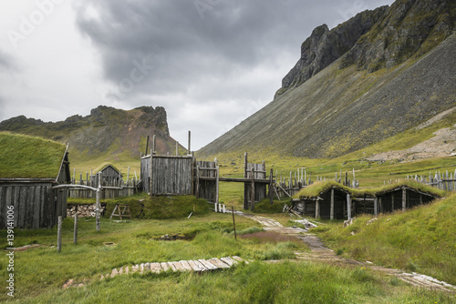Traditional Viking village. Wooden houses near Vestrahorn mountains on the Stokksnes Peninsula, Hofn, Iceland