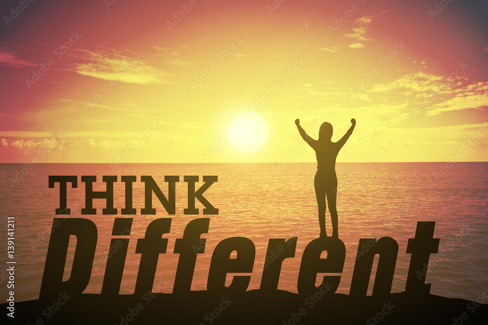 Silhouette young woman standing and raising up her hand about success concept with THINK DIFFERENT text over a beautiful sunset or sunrise at the sea. background for success. Silhouette young woman standing and raising up her hand about success concept with THINK DIFFERENT text over a beautiful sunset or sunrise at the sea. background for success.