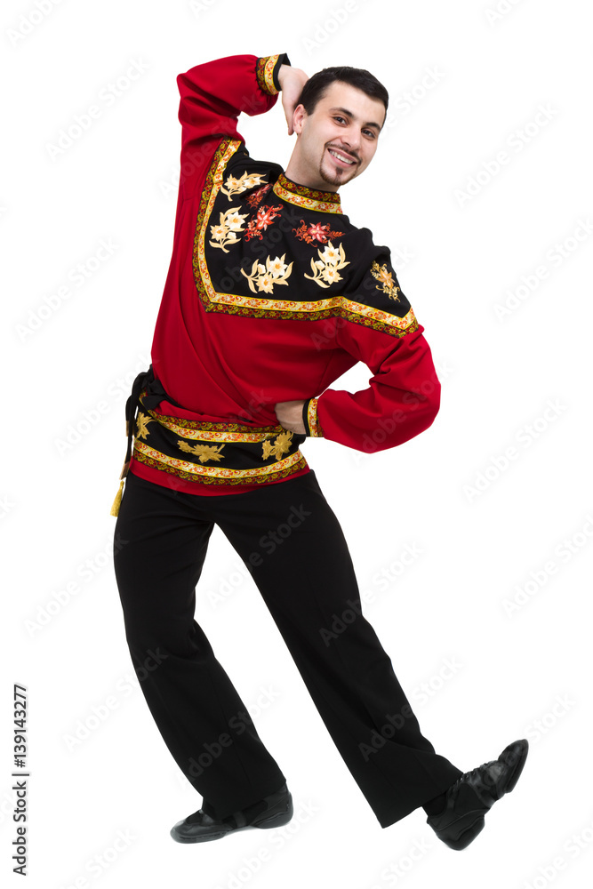 young man wearing a folk russian costume posing