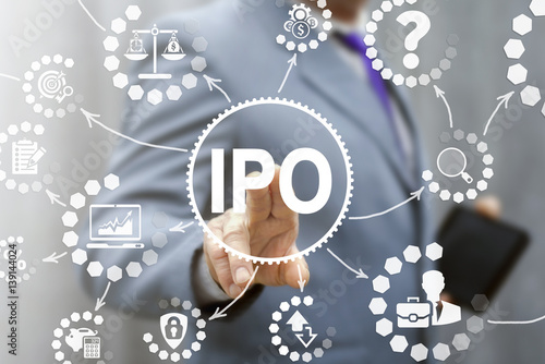 IPO (Initial Public Offering) finance business concept. Businessman touched ipo icon on virtual trading screen. Financial trade exchange investment and strategy technology. photo