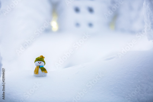 Snowy snowman. Snow background. New year Christmas greeting card with copy-space. Winter landscape in cold december day. photo