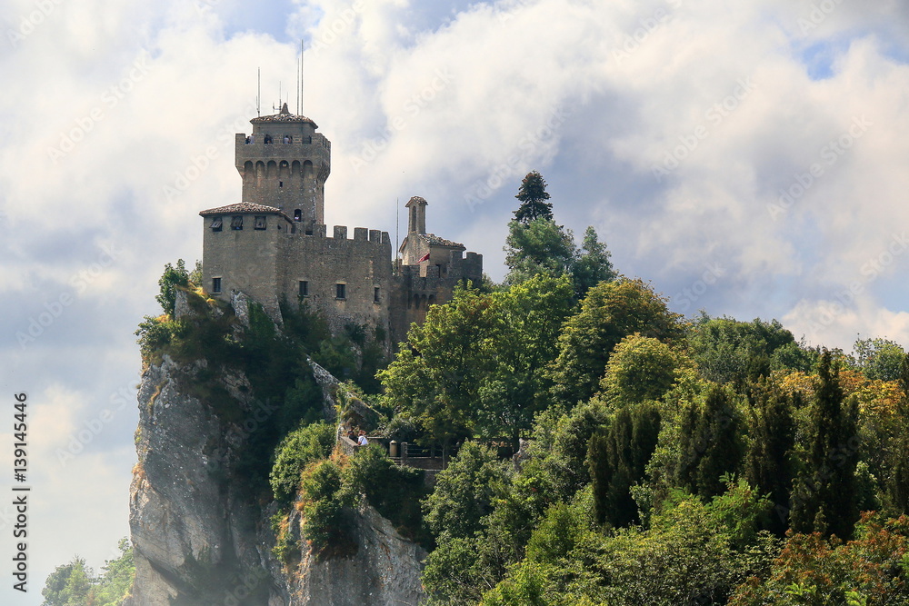 Beautiful view of the medieval tower De La Fratta or Cesta located on the highest of Monte Titano's summits in San Marino republic. Beautiful view of the medieval tower De La Fratta or Cesta located on the highest of Monte Titano's summits in San Marino republic.