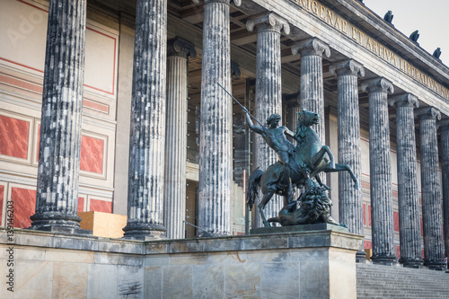 The pillars of the old museum on the museum island in Berlin, center with the lion fighter statue, Germany